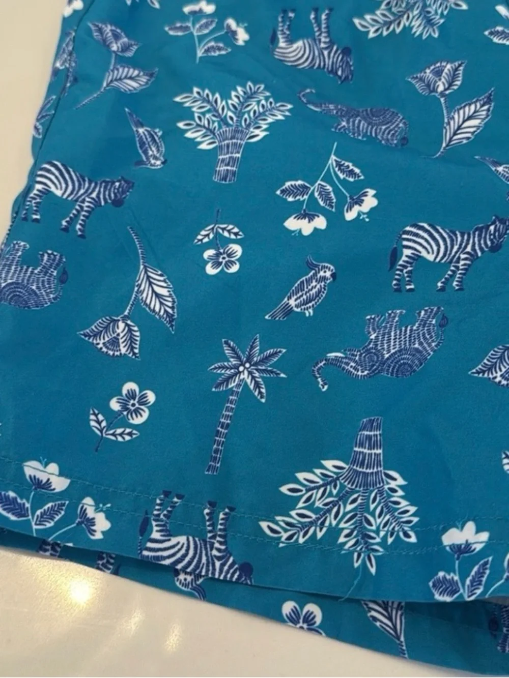 Janie and Jack Teal World Love Swim Trunks with Animal Print